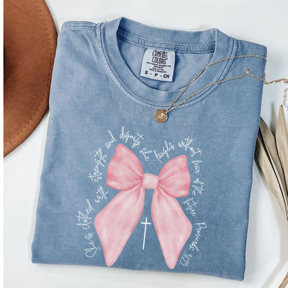 Christian Pink  Bow Bible Verse Faith Shirt, She is Clothed with Strength and Dignity Tee - Proverbs 31:25 Coquette Bow T-Shirt