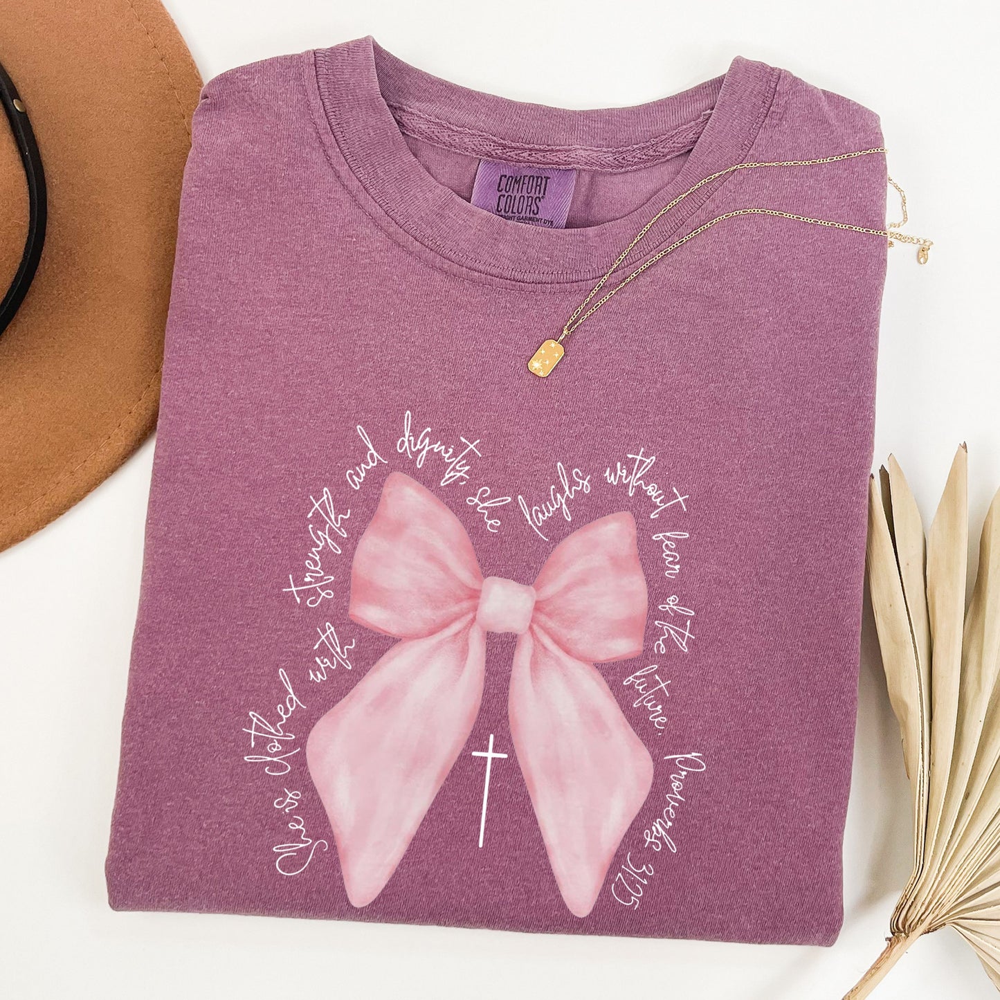Christian Pink  Bow Bible Verse Faith Shirt, She is Clothed with Strength and Dignity Tee - Proverbs 31:25 Coquette Bow T-Shirt